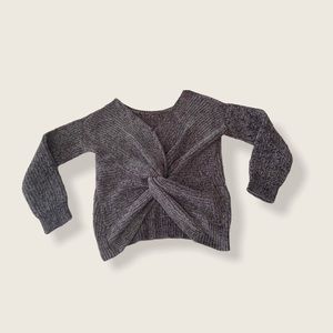 Gray knit sweater with twisted back. Runs big